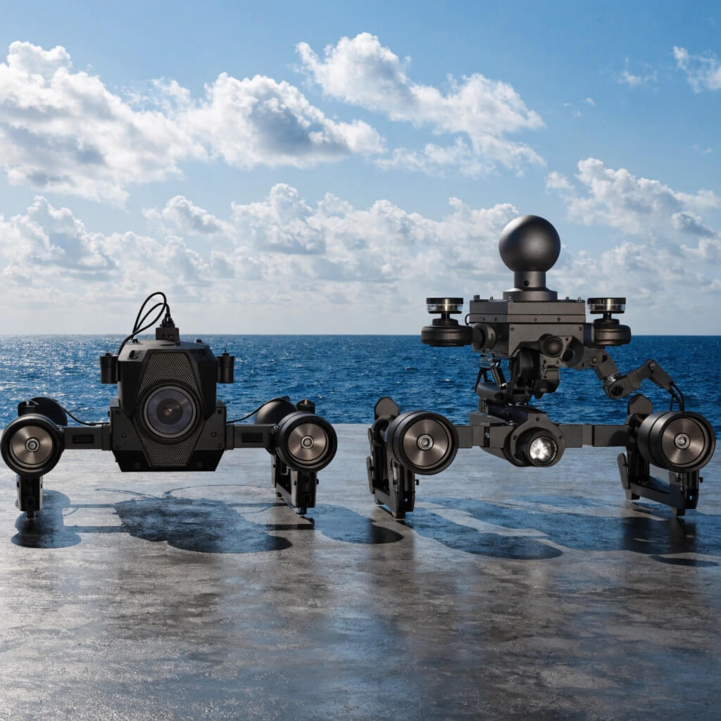 A large work-class ROV next to a small observation-class ROV