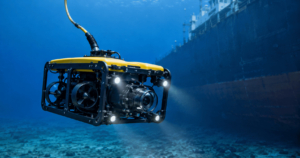Inspection-class ROV selected for ship hull inspection with visible thrusters, camera, lights, and tether